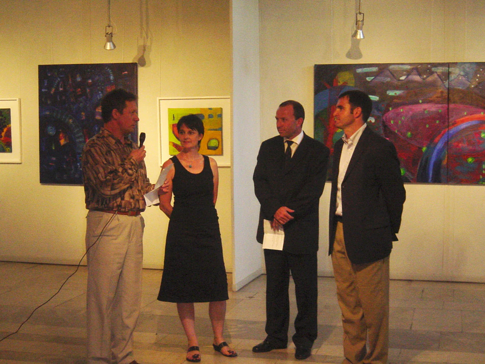 Opening Night at Worlds Apart Exhibition, all paintings by Mary O'Connor, second left.